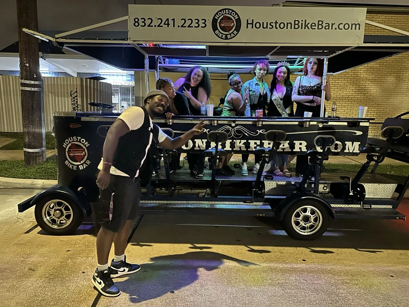 A bachelorette group on the Houston Bike Bar at night