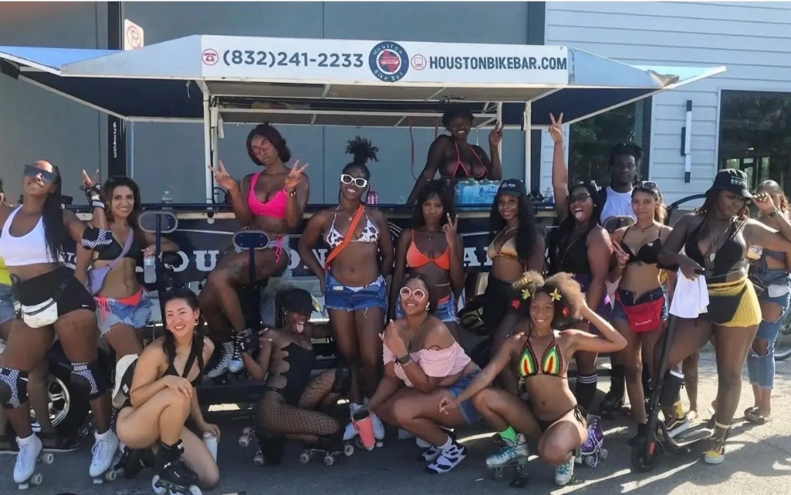 A full group of riders pedaling the Houston Bike Bar down the street