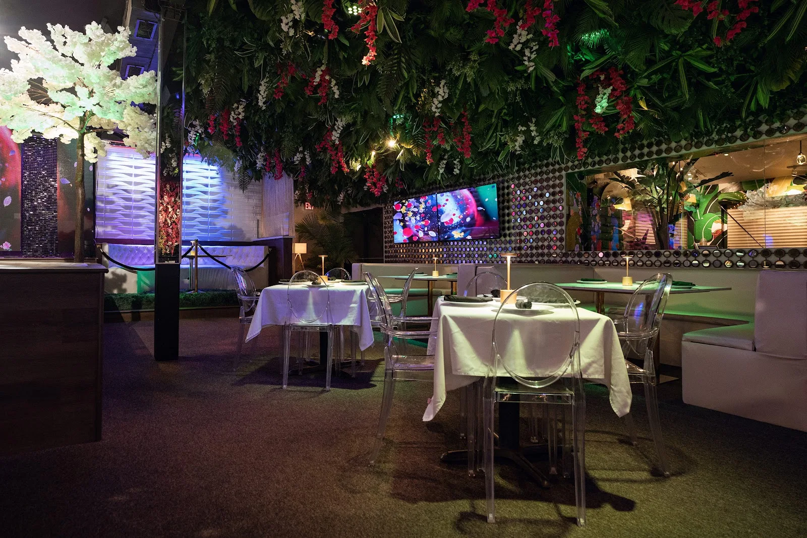 A dim dining room under a canopy of flowers at the Montrose Country Club