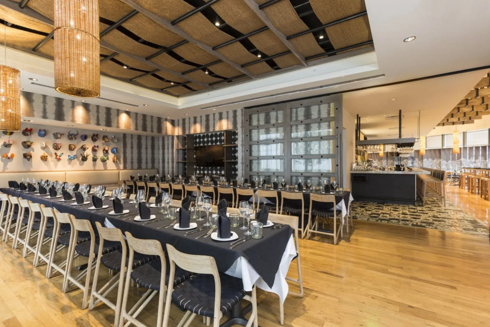 A long table set for a large party in a private dining room at Xochi in downtown Houston