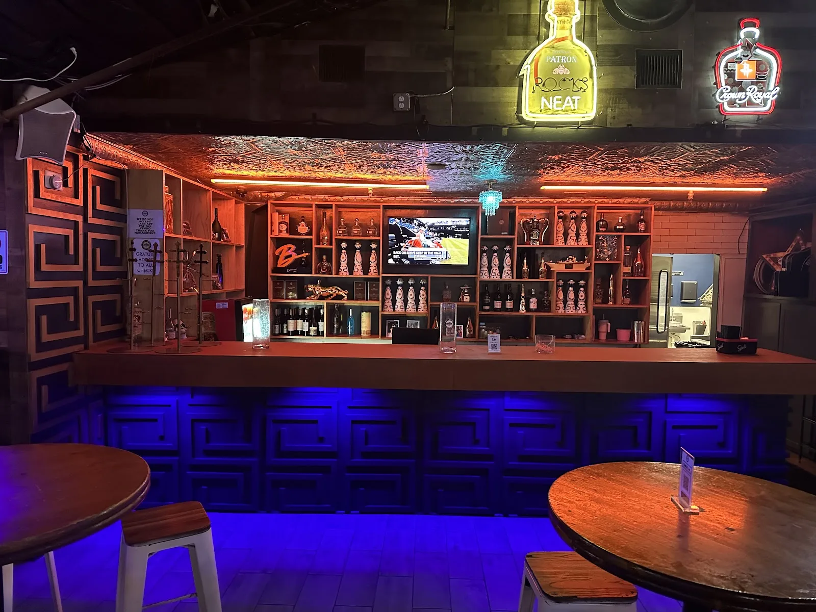 The neon-lit bar inside Belle Station in Midtown Houston