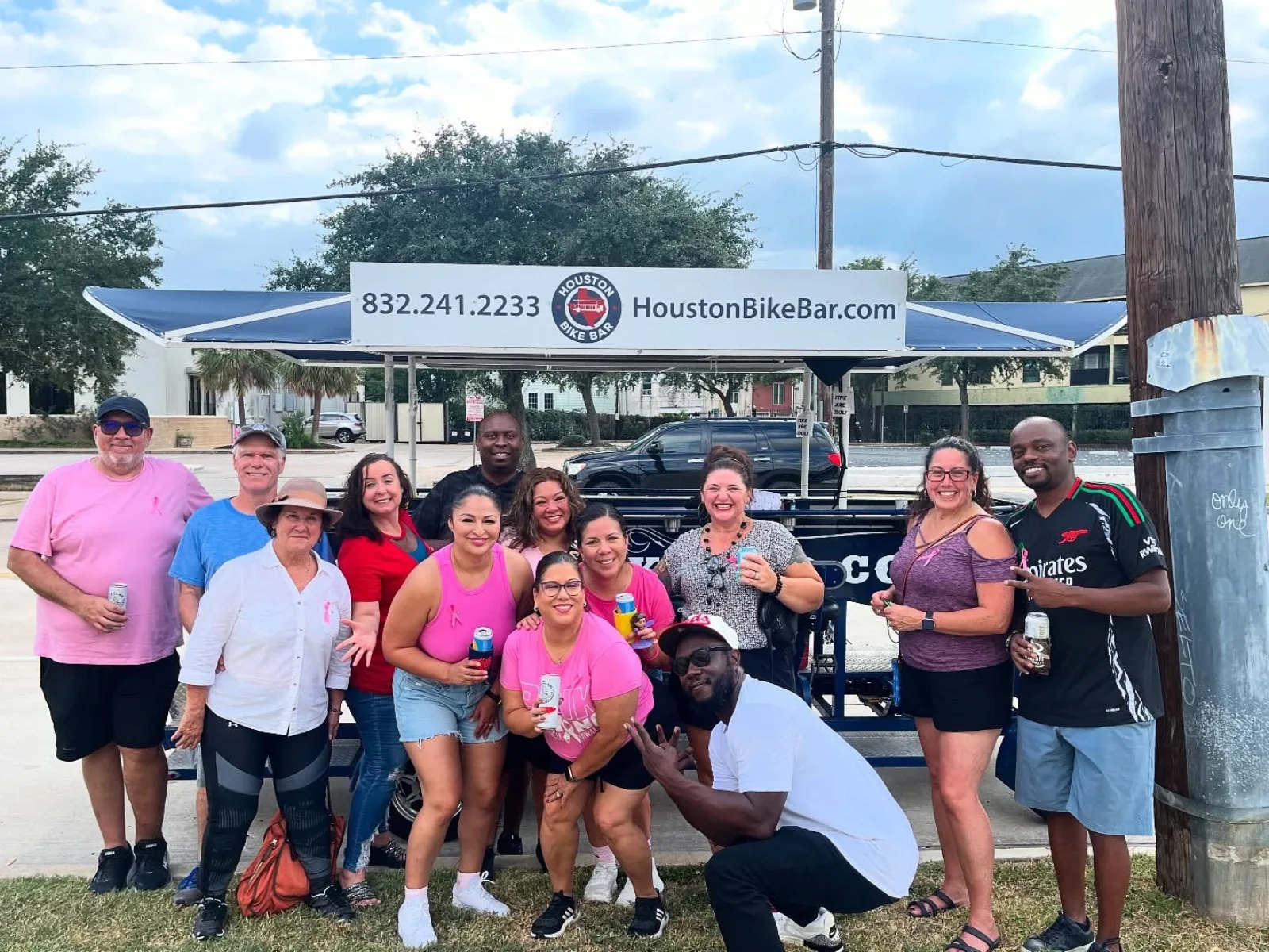 A group posing with the Houston Bike Bar
