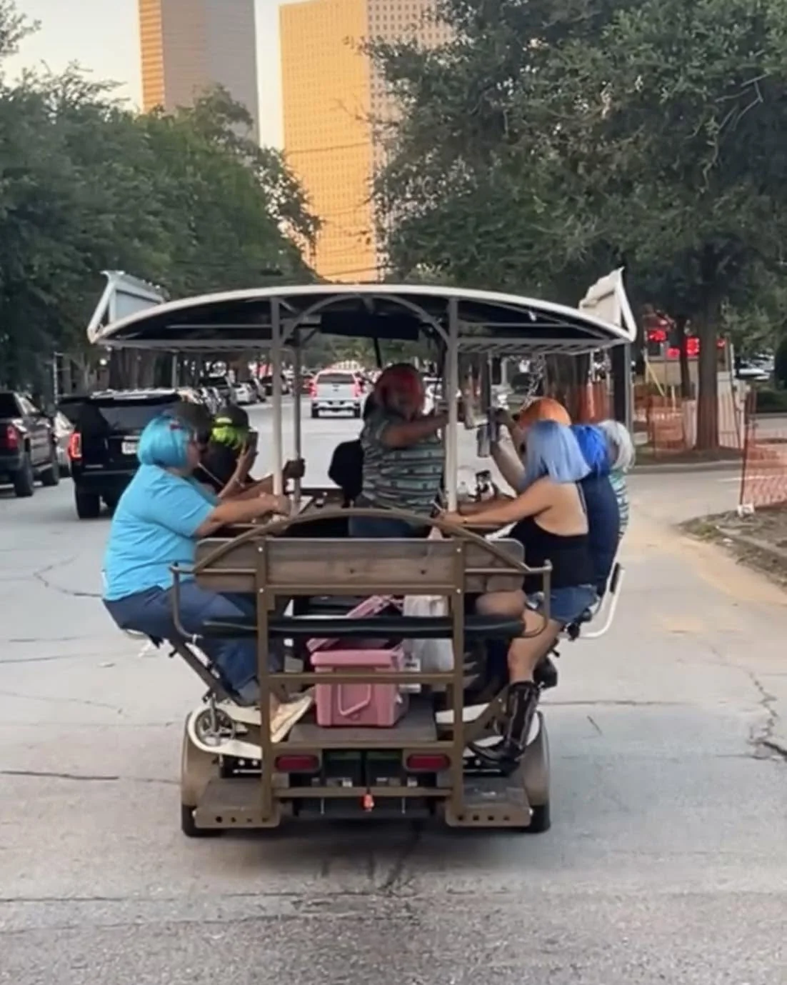 The bike bar riding down a Houston street with riders on board